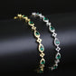 Emerald Cross Motif Tennis Bracelet