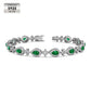Emerald Cross Motif Tennis Bracelet